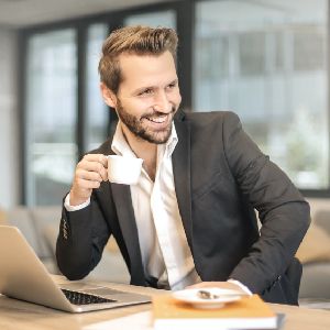 man smiling with tea